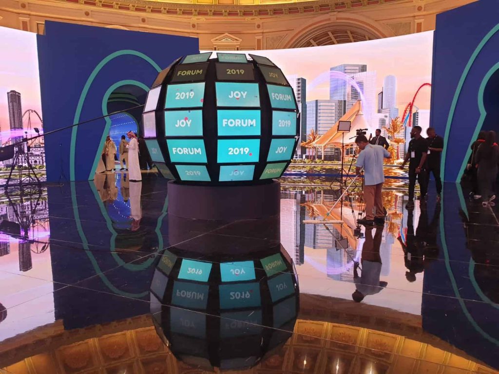 Entrance to JOY forum in Riyadh featuring LED TVs and entertainment