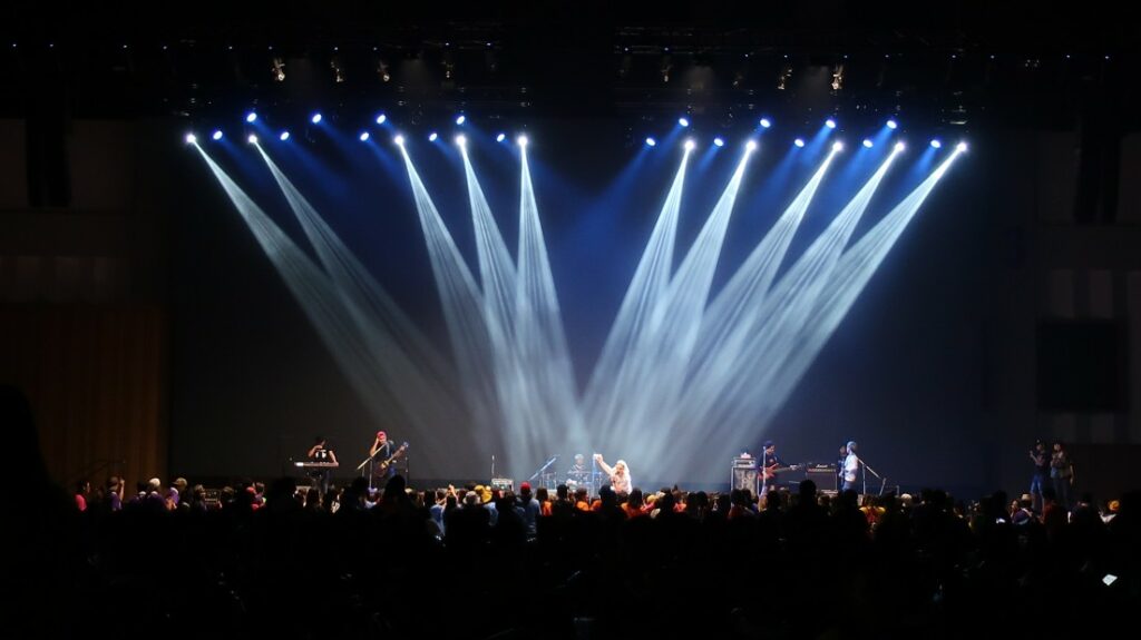 A Global Events Large production with stage, lighting and crowd.