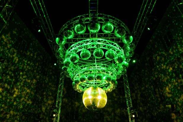a large green chandelier hanging from the ceiling.