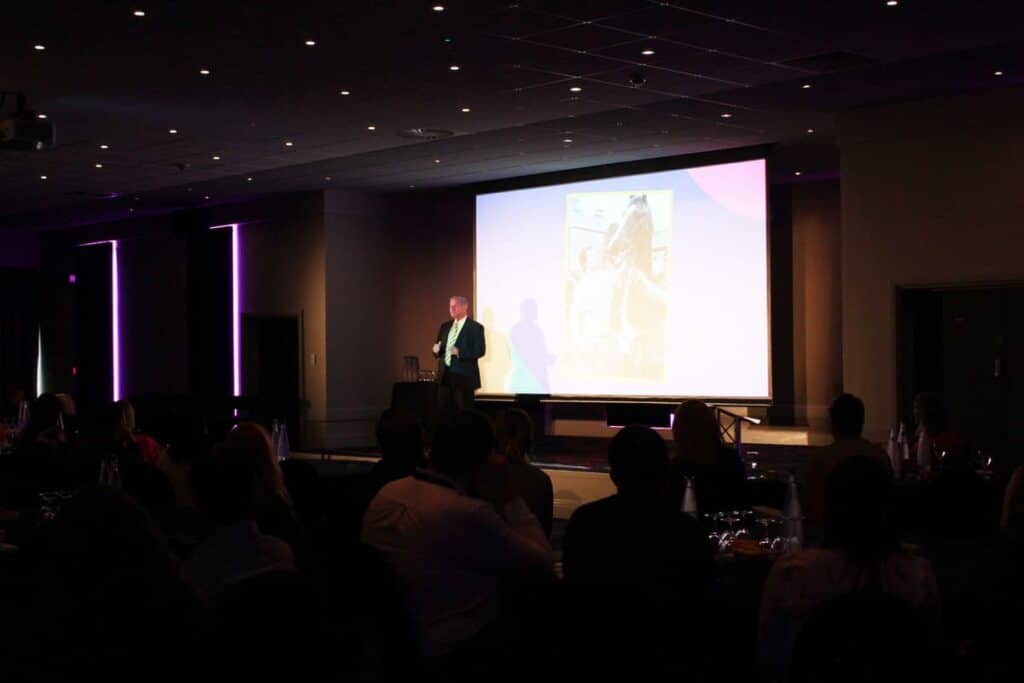 a speaker on stage at an event.