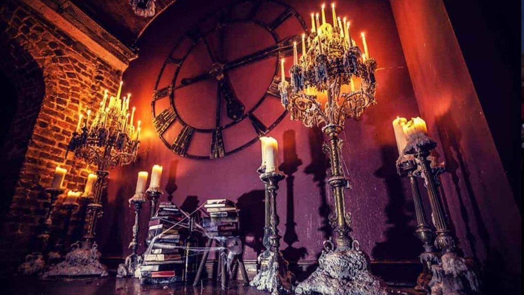 halloween props of candles and wall symbols