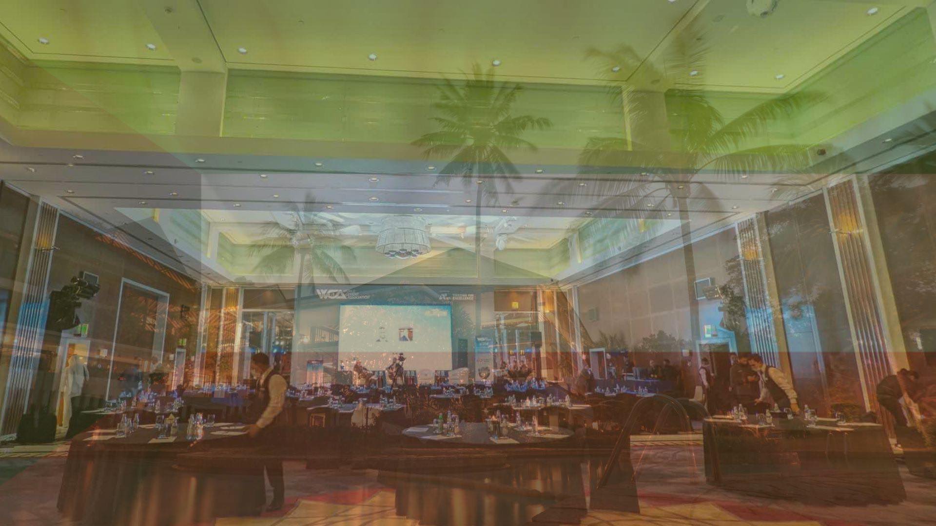 Hotels and conferences depicted over the Kuwait flag.
