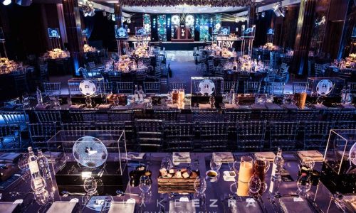 Luxury football event sit down dinner. We used our global immersive theming services to style this event space in luxury, elegant football decor